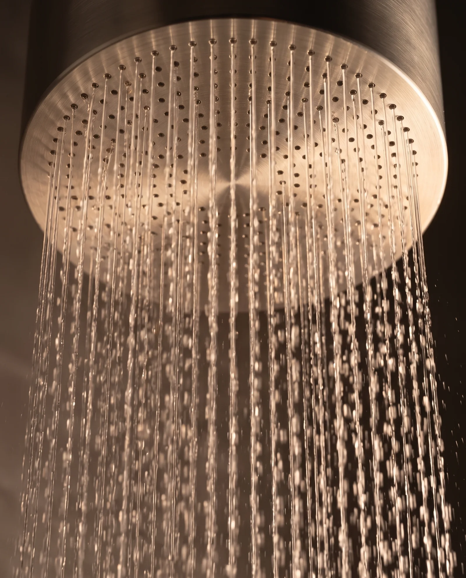 Close view of Monolith’s circular rainfall face and flowing water